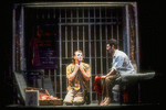 Actors Brent Carver (L) and Anthony Crivello talking in jail cell in scene from the play "Kiss of the Spider Woman" based on Manuel Puig novel.