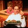 Actors Peter Friedman and Christine Baranski talking over large plate of chopped liver in a scene from the off-Broadway production of "The Loman Family Picnic"