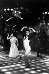 Actors John Travolta and Karen Gorney dancing (disco style) in a scene from the motion picture "Saturday Night Fever."