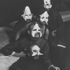 Five unidentified cast members wearing masks in a scene from the Off-Broadway production of the play "The Blacks."