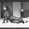 Actress Anita Morris wearing her famous lace bodysuit and lounging coyly during a scene from the Broadway production of "Nine.".