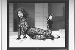 Actress Anita Morris wearing her famous lace bodysuit and lounging coyly during a scene from the Broadway production of "Nine.".
