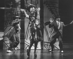 Actress Danitra Vance singing and dancing with two unidentified men in a performance of the Public Theater's production of "Spunk," three short plays based on the works of Zora Neale Hurston.