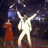 Actor John Travolta disco dancing with actress Karen Gorney in scene from the film "Saturday Night Fever"