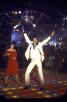 Actor John Travolta disco dancing with actress Karen Gorney in scene from the film "Saturday Night Fever"