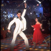 Actor John Travolta disco dancing with actress Karen Gorney in scene from the film "Saturday Night Fever"