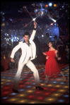 Actor John Travolta disco dancing with actress Karen Gorney in scene from the film "Saturday Night Fever"