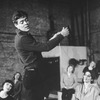 Actor Raul Julia conducting an orchestra of the women in his life incl. Karen Akers (2L) during a rehearsal for the Broadway production of the musical "Nine.".