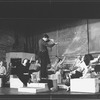 Actor Raul Julia conducting an orchestra of the women in his life incl. Karen Akers (3L) and Anita Morris (2L) during a rehearsal for the Broadway production of the musical "Nine".