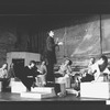 Actor Raul Julia conducting an orchestra of the women in his life incl. Karen Akers (3L) and Anita Morris (L) during a rehearsal for the Broadway production of the musical "Nine".