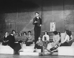 Actor Raul Julia conducting an orchestra of the women in his life incl. Karen Akers (2L) and Anita Morris (L) during a rehearsal for the Broadway production of the musical "Nine.".