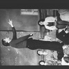 Actor Raul Julia conducting an orchestra of the women in his life during a rehearsal for the Broadway production of the musical "Nine".