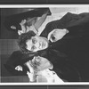 Actor Raul Julia with two dancers in bkgrd. in a scene from the Broadway production of the musical "Nine".