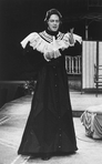 Actor Raul Julia wearing a dress in a scene from the Circle in the Square production of the musical "Where's Charley?"