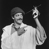 Actor Raul Julia holding a toy helicopter in a scene from the NY Shakespeare Festival Central Park production of the play "The Tempest."
