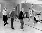 Choreographer Jerome Robbins showing dancer Michael Scott Gregory (2L) a move as asst. director Grover Dale (2R) looks on during a rehearsal of the Broadway production of the musical "Jerome Robbins' Broadway.".