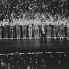 Director/choreographer Michael Bennett (C), flanked by dancers from all companies, greeting the invited audience at performance #3,389 of the Broadway production of the musical "A Chorus Line," making it the longest running show in Broadway history.