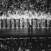 Director/choreographer Michael Bennett (C), flanked by dancers from all companies, greeting the invited audience at performance #3,389 of the Broadway production of the musical "A Chorus Line," making it the longest running show in Broadway history.