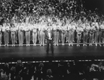 Director/choreographer Michael Bennett (C), flanked by dancers from all companies, greeting the invited audience at performance #3,389 of the Broadway production of the musical "A Chorus Line," making it the longest running show in Broadway history.