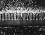 Director/choreographer Michael Bennett (C), flanked by dancers from all companies, greeting the invited audience at performance #3,389 of the Broadway production of the musical "A Chorus Line," making it the longest running show in Broadway history.