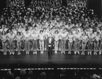 Director/choreographer Michael Bennett (C), flanked by dancers from all companies, greeting the invited audience at performance #3,389 of the Broadway production of the musical "A Chorus Line," making it the longest running show in Broadway history.