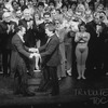 Director/choreographer Michael Bennett (L), flanked by creative staff and dancers from all companies, greeting the producer Joseph Papp at performance #3,389 of the Broadway production of the musical "A Chorus Line," making it the longest running showin. Broadway history.