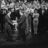 Director/choreographer Michael Bennett (L), flanked by creative staff and dancers from all companies, greeting the producer Joseph Papp at performance #3,389 of the Broadway production of the musical "A Chorus Line," making it the longest running showin. Broadway history.