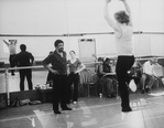 Choreographer Alvin Ailey (L) working with a dancer in the studio.
