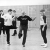 Director-choreographer Jerome Robbins (c) working with dancer Robert LaFosse (2L) on a number from "Fiddler On The Roof" at a rehearsal of the Broadway production of the musical "Jerome Robbins' Broadway.".