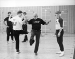 Director-choreographer Jerome Robbins (c) working with dancer Robert LaFosse (2L) on a number from "Fiddler On The Roof" at a rehearsal of the Broadway production of the musical "Jerome Robbins' Broadway.".