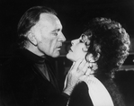 Actors Elizabeth Taylor and Richard Burton about to kiss while rehearsing a scene from the Broadway revival of the play "Private LIves".
