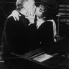 Actors Elizabeth Taylor and Richard Burton about to kiss while rehearsing a scene from the Broadway revival of the play "Private LIves".