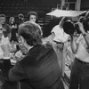 Producer Joseph Papp (2L) being filmed amidst rubble during the renovation of the Anspacher Theatre at Papp's NY Shakespeare Festival.