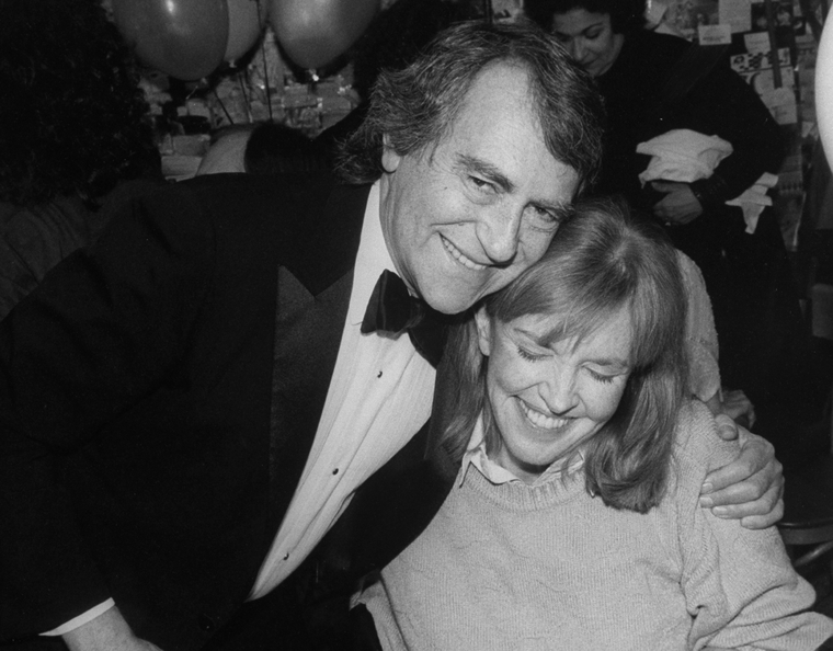 Producer Joseph Papp hugging actress Anne Meara at the opening night ...