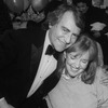 Producer Joseph Papp hugging actress Anne Meara at the opening night party for the NY Shakespeare Festival production of the play "Cafe Crown".