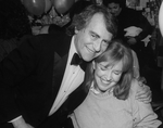 Producer Joseph Papp hugging actress Anne Meara at the opening night party for the NY Shakespeare Festival production of the play "Cafe Crown".