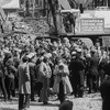 Producer Joseph Papp (C, with bullhorn) and crowd of demonstrators standing in rubble after an unsuccessful protest over the demolition of two Broadway theaters.