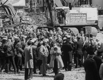 Producer Joseph Papp (C, with bullhorn) and crowd of demonstrators standing in rubble after an unsuccessful protest over the demolition of two Broadway theaters.