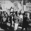 Unidentified people demonstrating by rubble during an unsuccessful protest over the demolition of two Broadway theaters