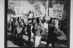 Unidentified people demonstrating by rubble during an unsuccessful protest over the demolition of two Broadway theaters