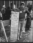 Unidentified theater person holding sign which reads WE MAY HAVE LOST IN COURT BUT THAT WON'T STOP US/SAVE THE HELEN HAYES AND THE MOROSCO during an unsuccessful protest over the demolition of two Broadway theaters