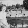 Fight choreographer B.H. Barry sitting in seats at the Delacorte theatre in Central Park with actors onstage in bkgrd. working on a fight for a NY Shakespeare Festival production.