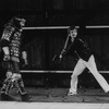 Fight choreographer B.H. Barry (R) showing a move to an actor onstage at the Delacorte theatre in Central Park for a NY Shakespeare Festival production.