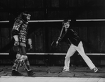 Fight choreographer B.H. Barry (R) showing a move to an actor onstage at the Delacorte theatre in Central Park for a NY Shakespeare Festival production.