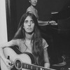 Composer Elizabeth Swados (foreground) playing guitar with Judith Fleisher on piano