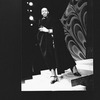 Director Geoffrey Holder wearing a black cape on the set of the Broadway production of the musical "The Wiz.".