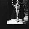 Director Geoffrey Holder wearing a black cape on the set of the Broadway production of the musical "The Wiz.".