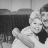 Actors Debbie Reynolds and Jamie Ross hugging during a break in rehearsal for the Broadway production of the musical "Woman Of The Year".