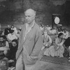 Director Peter Brook surrounded by his cast on the set of the BAM production of the play "The Mahabharata.".