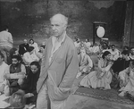 Director Peter Brook surrounded by his cast on the set of the BAM production of the play "The Mahabharata.".